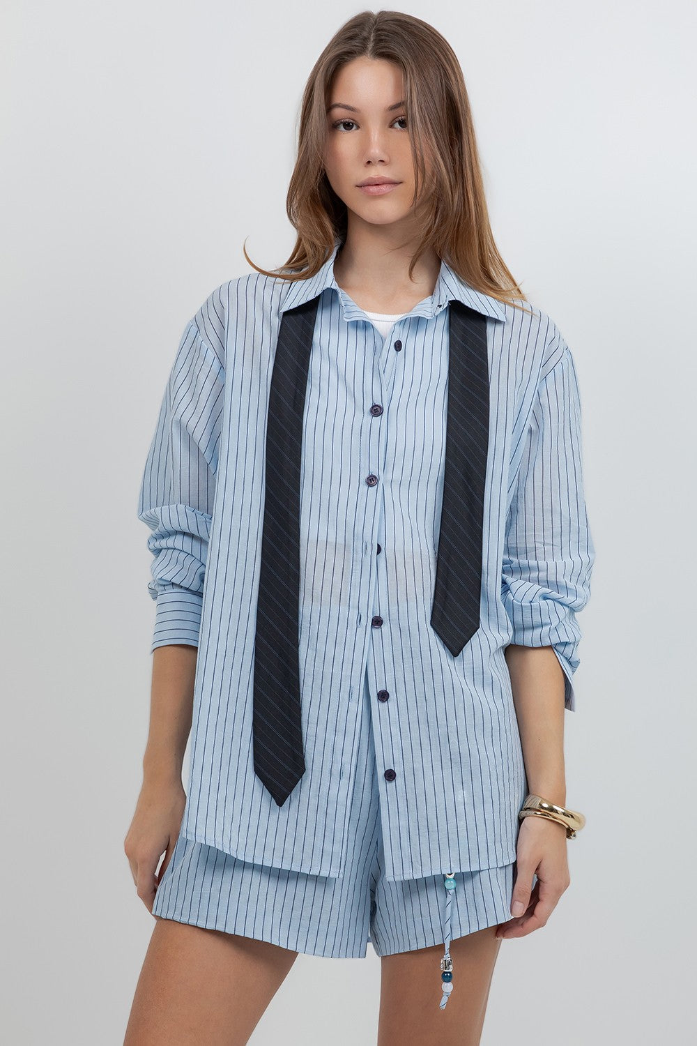 Detachable neck tie shirt and short set.